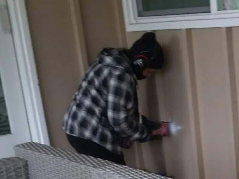 Professional electrician installing an exterior outlet in Harrisburg