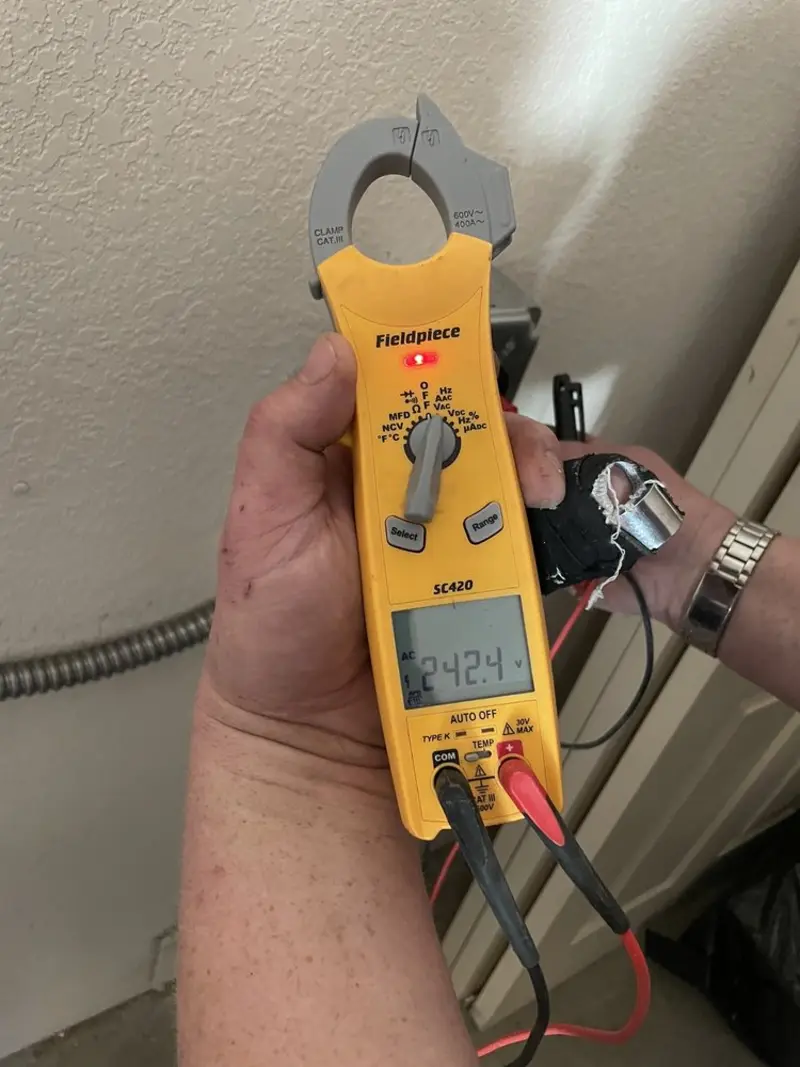 Voltage testing with clamp meter during Recessed Lighting Installation in Harrisburg